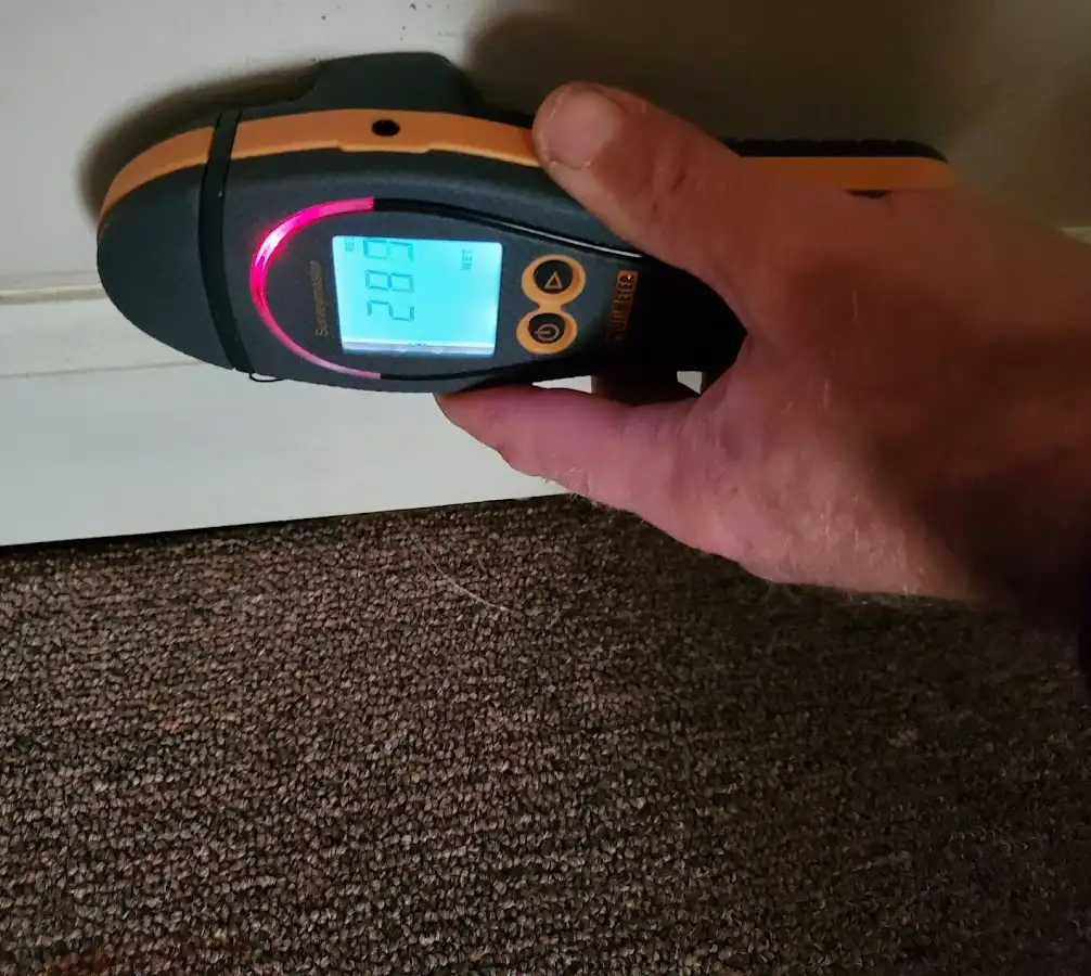 Moisture detection at baseboard during Storm Damage Restoration in Sioux City